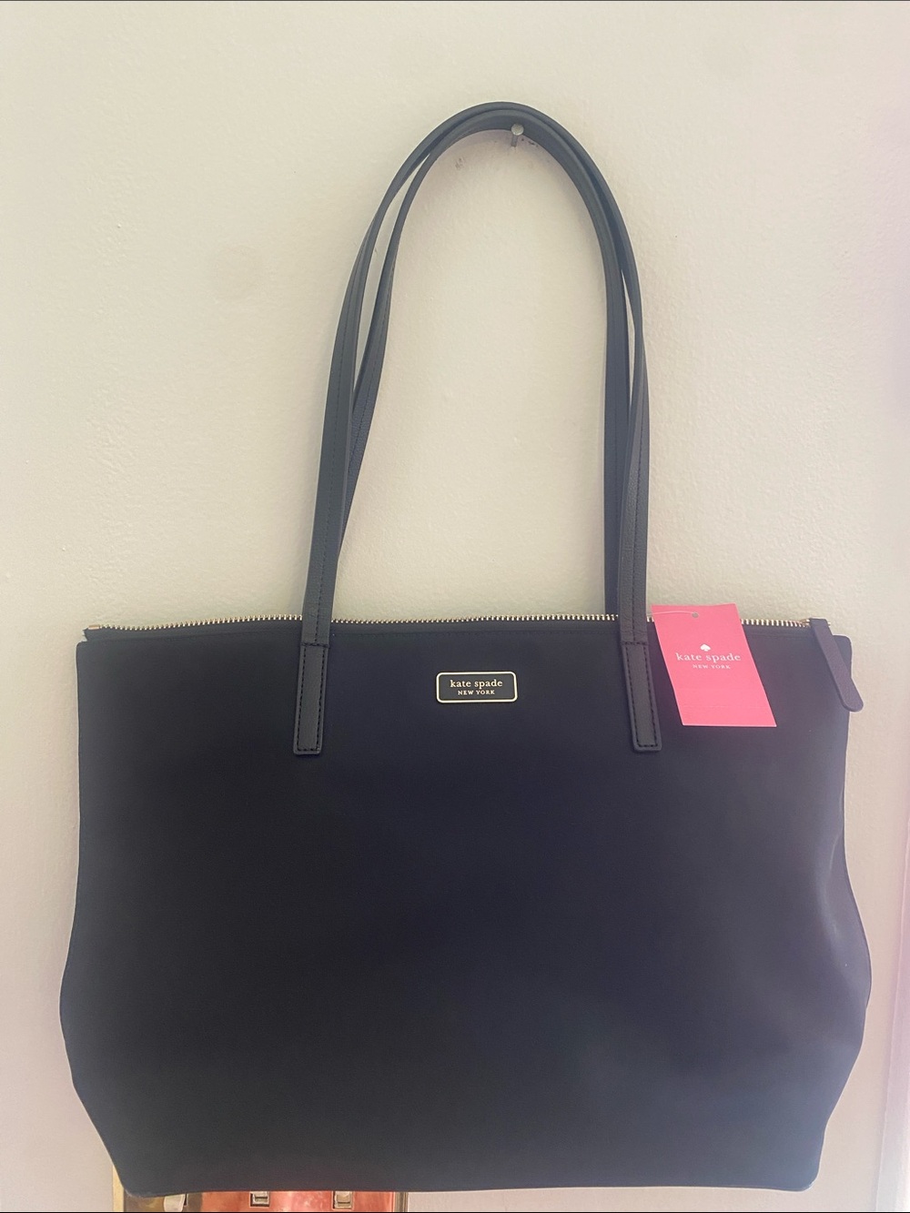 kate spade black tote with gold logo plaque